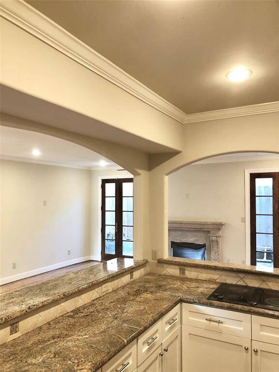 Lots of light and neutral paint colors as well as the ornamental carved stone fireplace  mantel will make this home easy to decorate.