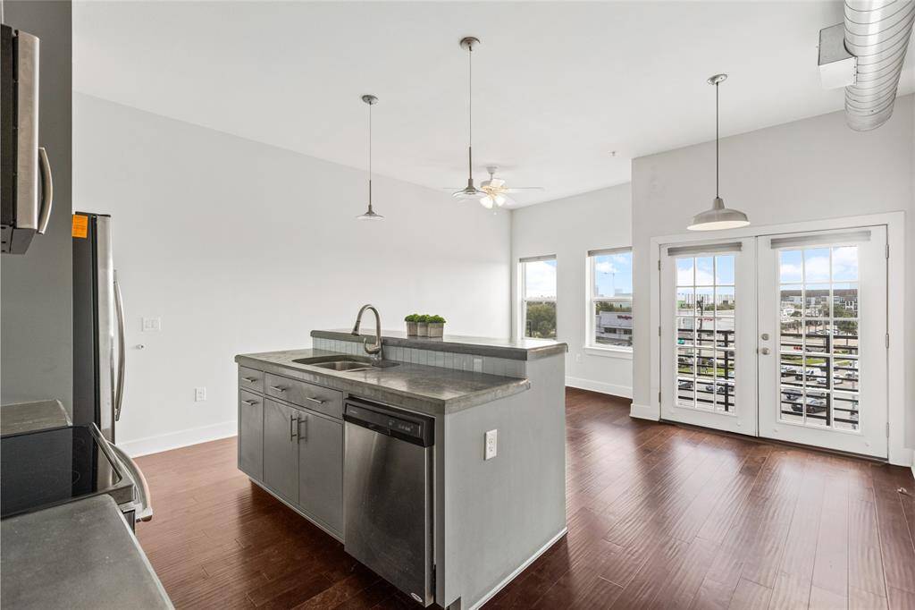 Gorgeous light filled top floor condo with private balcony and hardwoods though out!