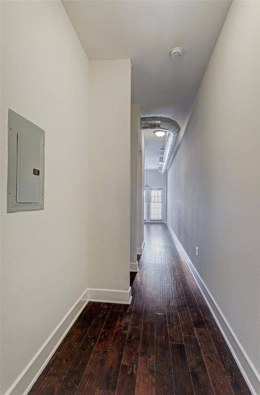 Gleaming hardwoods though out,  extra long hallway provides ample wall space for art and a console table