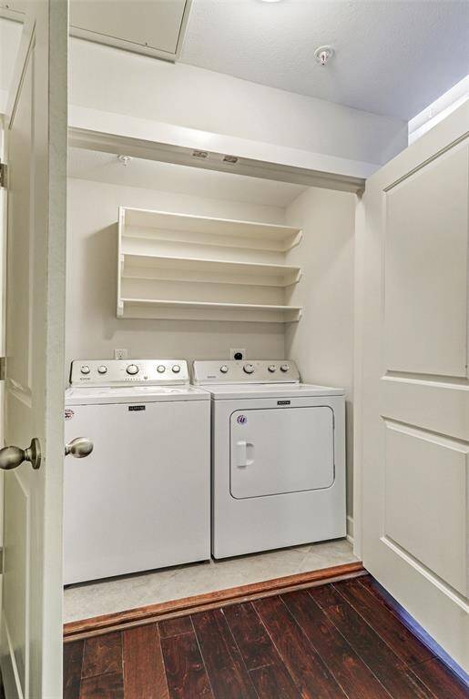 Conveniently located utility room, with full size washer and dryer, and built ins for additional storage