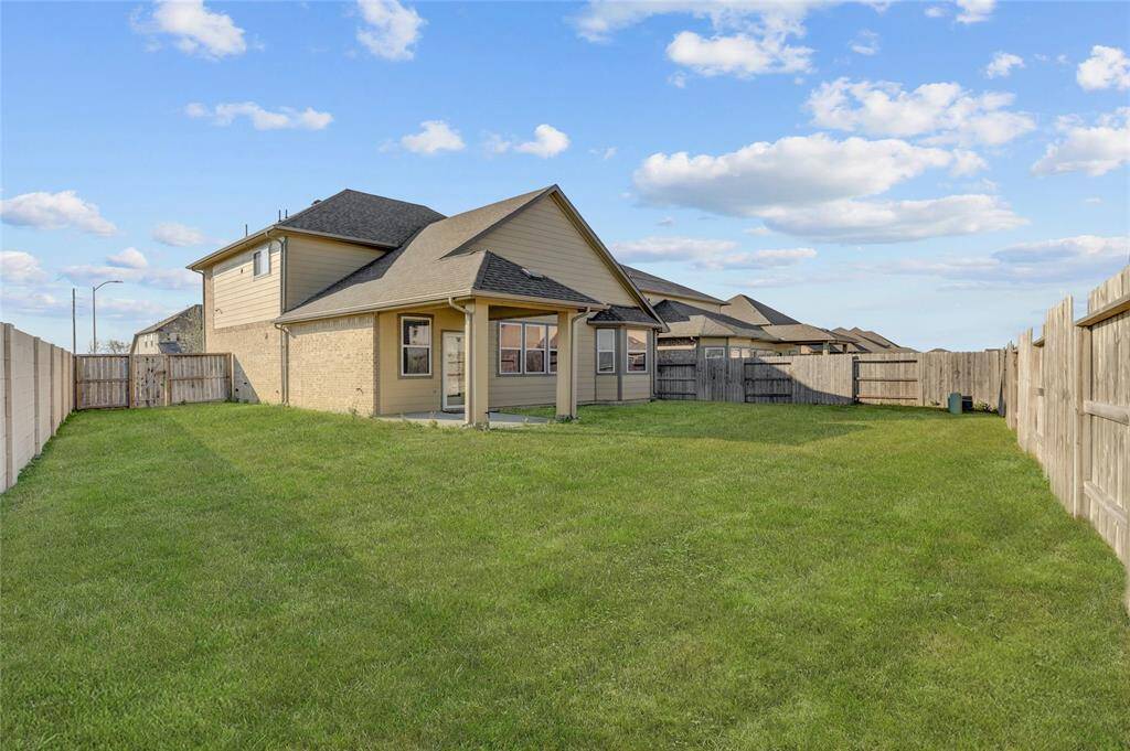 A spacious backyard offering plenty of room for outdoor activities and relaxation.