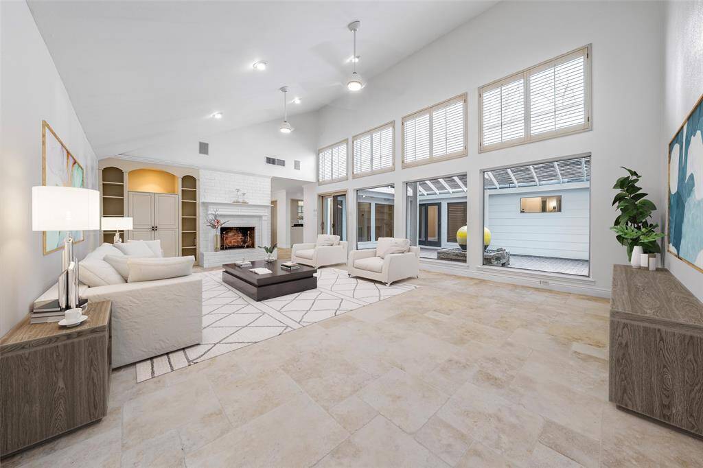 Experience the grandeur of the living room with vaulted ceilings draw your eyes upward in awe. Picture yourself relaxing in this open, airy sanctuary, where styles meets comfort in perfect harmony. (vs)