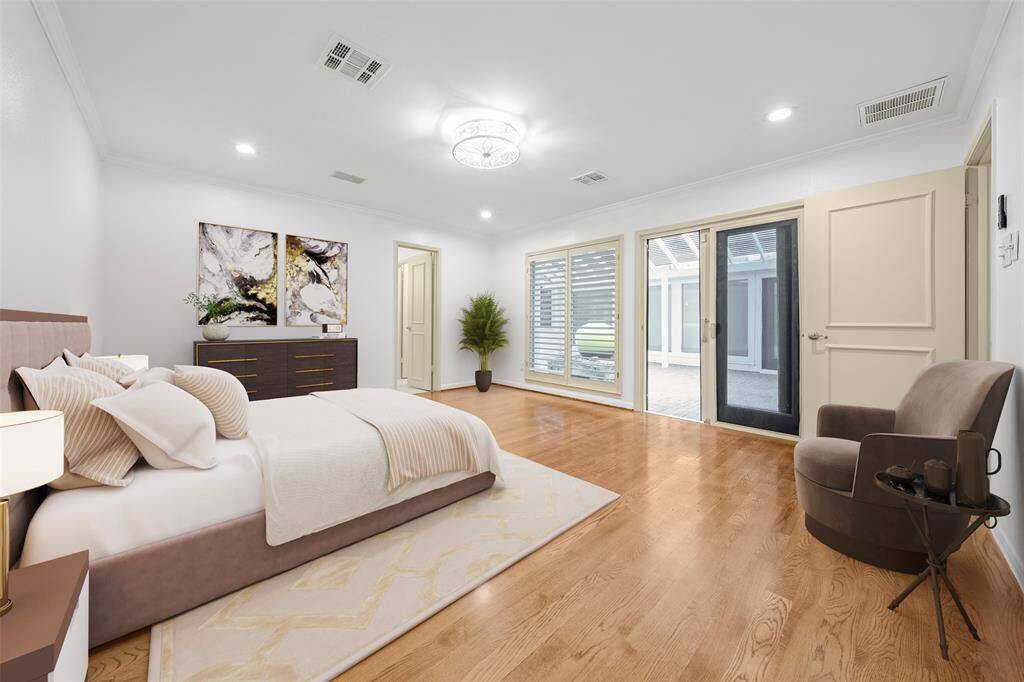 Experience the seamless flow from your private haven to a sun-drenched patio, offering ease of access and the perfect spot to bask in the abundant natural light. A primary suite with a view! (vs)