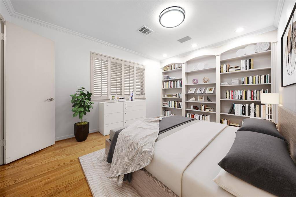 Step into the charming second bedroom with the beautiful, elegant built-in bookcase - a dream come true for any book lover. This stunning feature offers ample space to showcase your literacy collection, making it the perfect nook for cozy reading sessions. Imagine yourself curled up with your favorite book in this delightful haven. (vs)