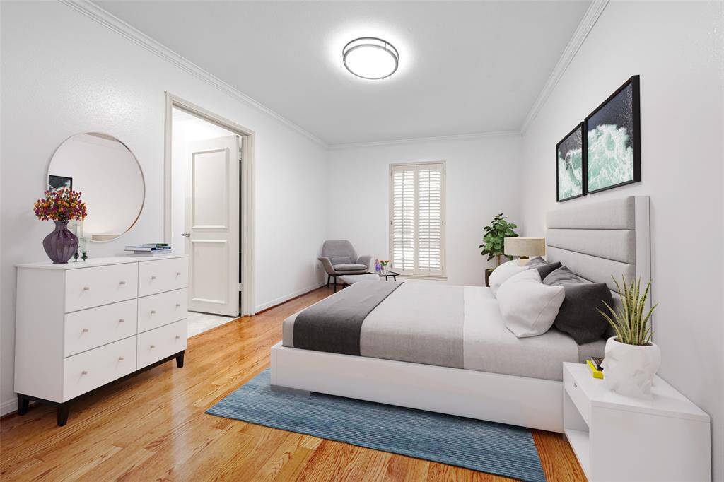 Adorned with classic plantation shutters, this third bedroom is bathes in natural sunlight, creating a warm and inviting atmosphere. (vs)