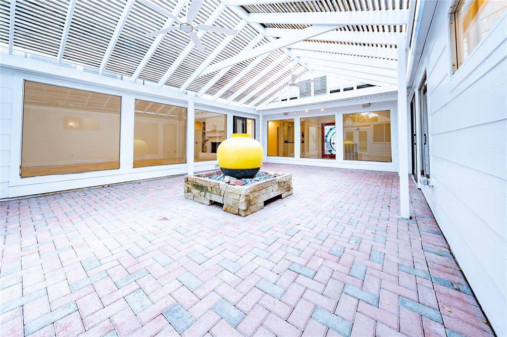 Step into your enclosed patio oasis, where stunning decorative centerpiece takes center stage. With endless possibilities for arrangement and decor, this patio is truly a canvas for your outdoor living dreams.