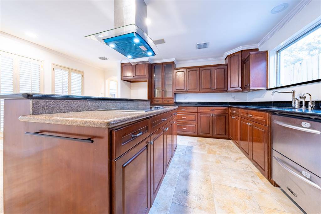 Discover the heart of the home: a stunning island kitchen that exudes both elegance and functionality. Featuring sleek granite countertops, this culinary haven is perfect for creating gourmet meals and lasting memories.