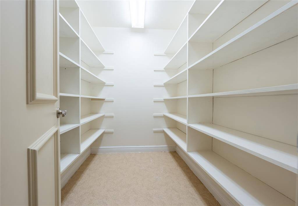 Adding to its charm, your walk-in pantry is filled with layers of shelves and shelves for all your culinary storage needs.