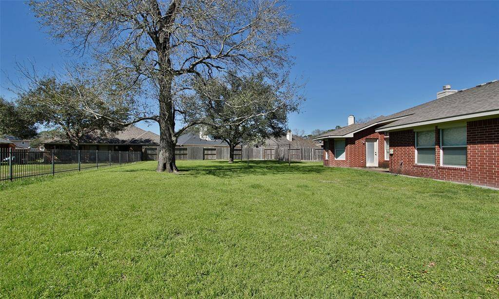 The yard is fully fenced with a rod iron fence.  This lot is on the lake and has access to the walking trail.