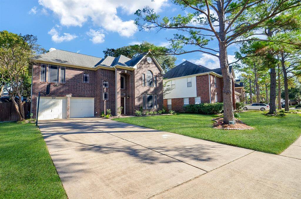 NO NEED TO PARK IN THE STREET WITH THIS EXTENDED DRIVEWAY. NOTICE THE CUSTOM SUNSCREENS ON THE WINDOWS. HELPS WITH THE ENERGY BILLS
