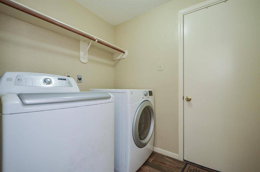 UTILITY ROOM LOCATED ON FIRST FLOOR TO THE GARAGE. PERFECT PLACE TO REMOVE DIRTY CLOTHES, ETC BEFORE ENTERING HOME.
