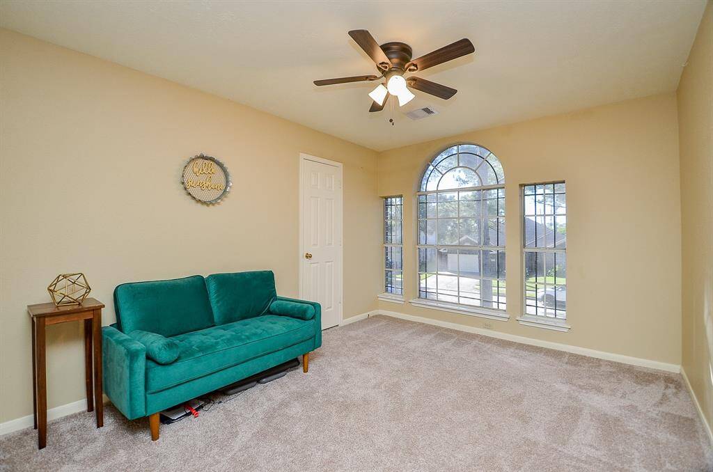 GAMEROOM AREA WITH CEILING FAN AND CLOSET FOR ADDTIONAL STORAGE