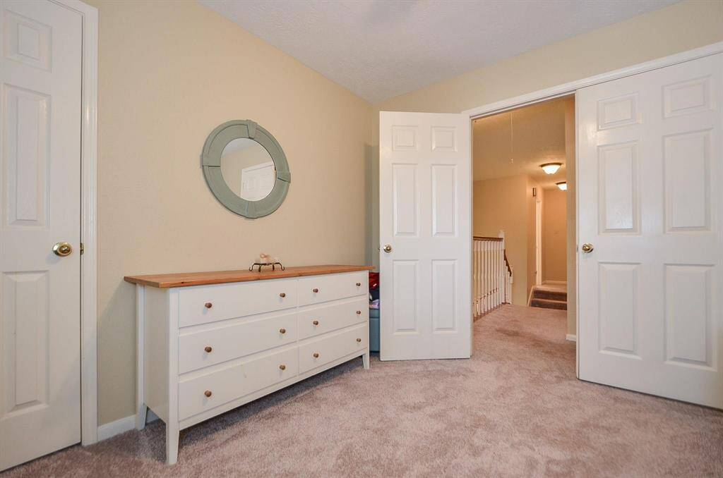 VIEW FROM RIGHT BEDROOM. NOTICE AT THE TOP OF THE STAIRS YOU CAN WALK TO THE LEFT OF THE HOME* 2 ADDITIONAL BEDROOMS* OR TO THE RIGHT WHERE THE GAME ROOM, BEDROOM AND MASTER ARE LOCATED