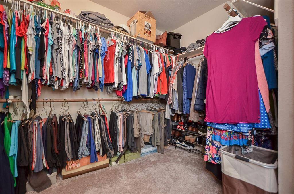 A PORTION OF LARGE PRIMARY CLOSET