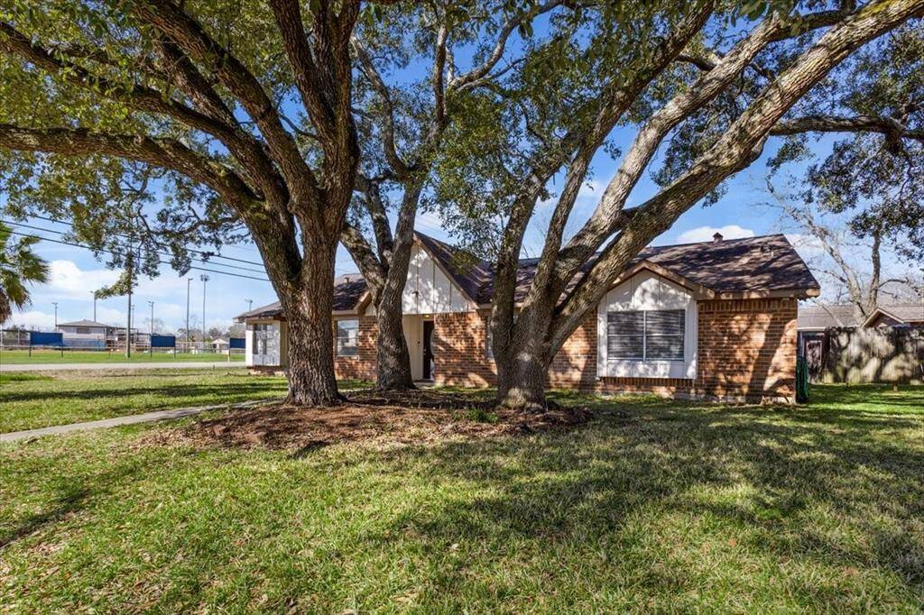 Situated on a corner lot with mature trees