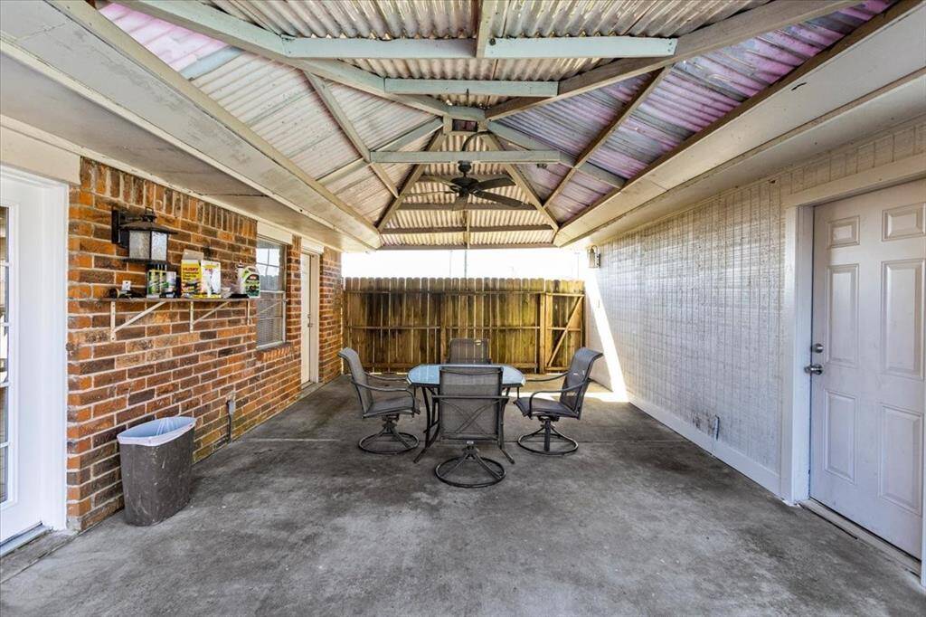 Covered patio leading from home to garage