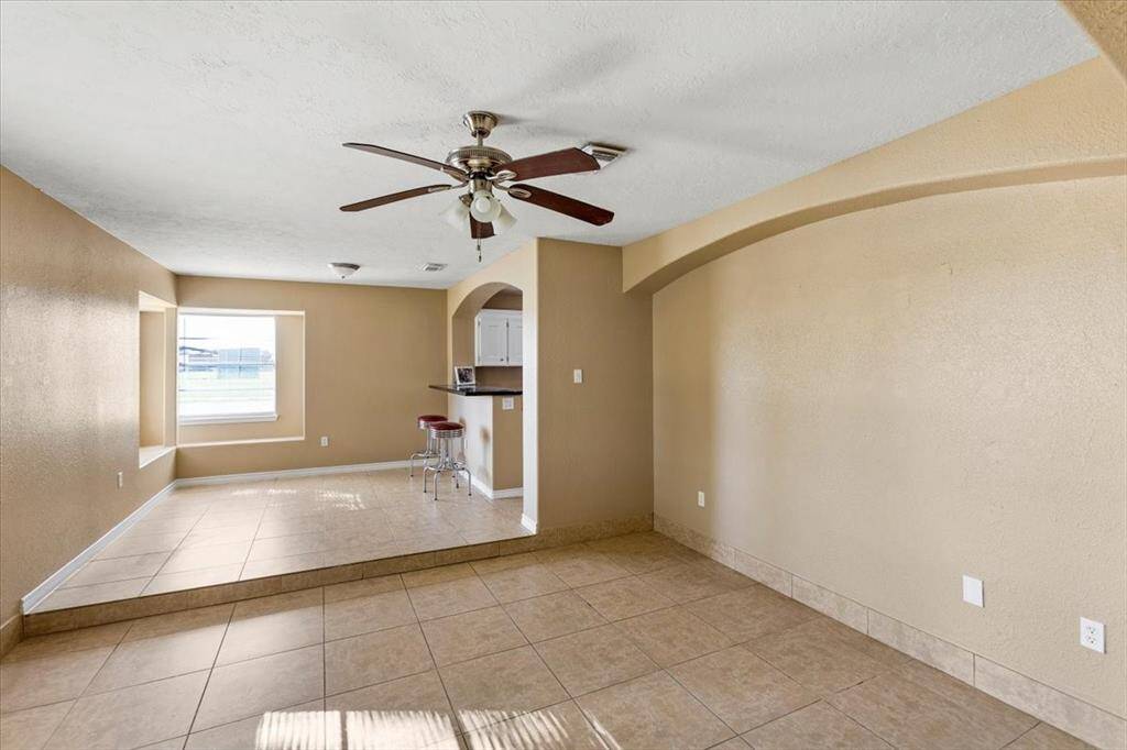 Formal living and breakfast room located at the front of the home