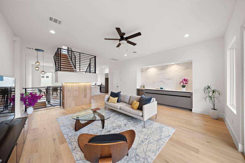 The heart of the home, this living room is designed to serve multiple purposes, providing a comfortable area for relaxation, entertainment and quality time with family and friends.