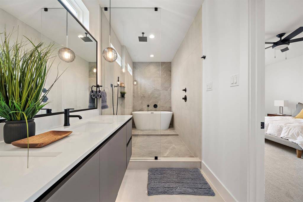 Experience ultimate relaxation in this stunning luxury spa-inspired bathroom, featuring a spacious central freestanding bathtub as its centerpiece.
