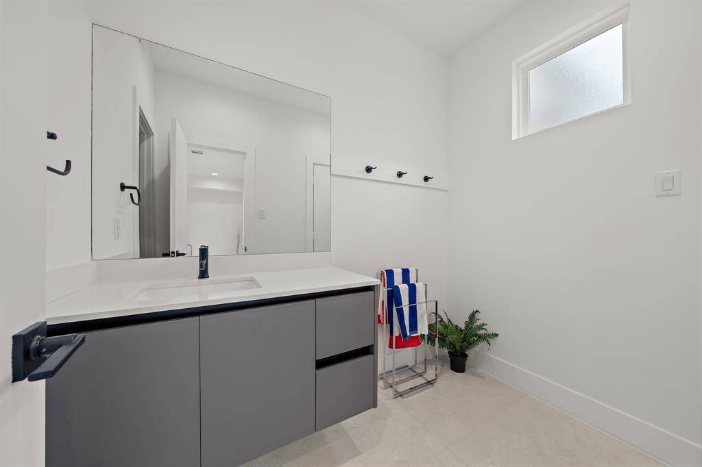 This full bath on the first floor provides easy access from the pool, and the 1st floor room making it ideal for refreshing after a swim or serving when entertaining in the flex room. A true blend of style and functionality, offering comfort and convenience.