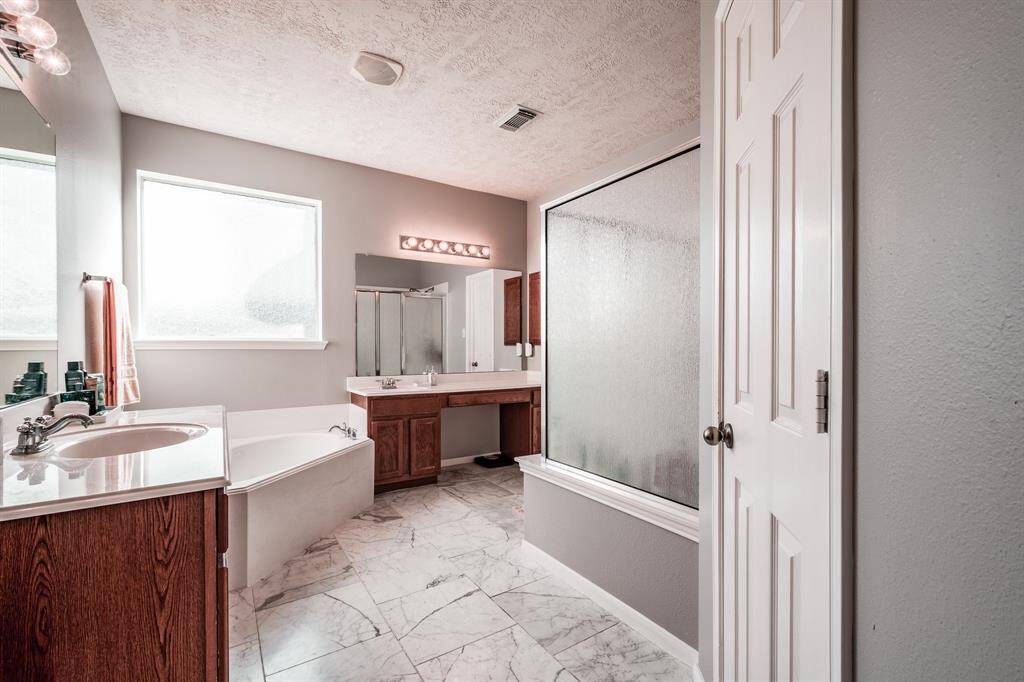 Primary Bathroom downstairs with double vanities