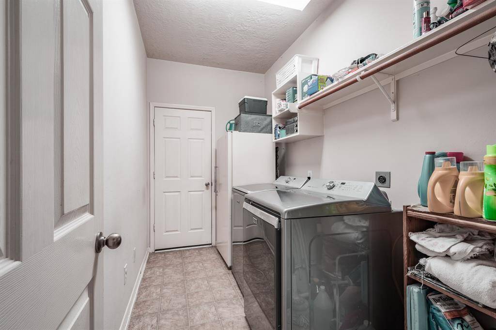 Large utility room with leads to garage