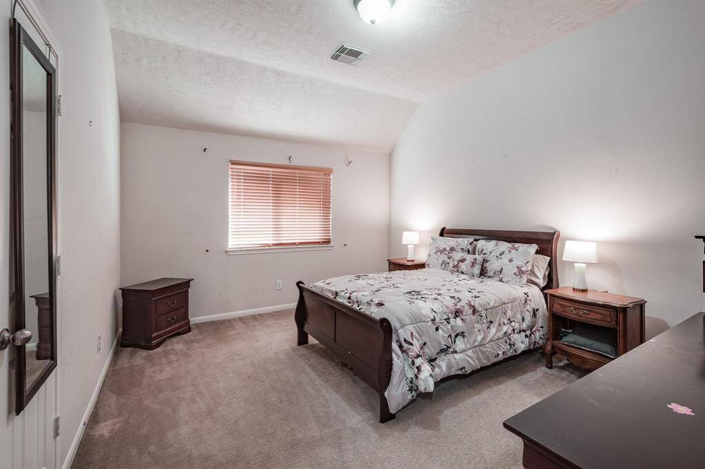 Secondary bedroom with walk-in closet
