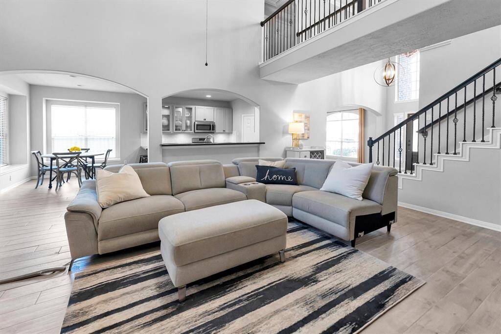 Another view of family room looking toward kitchen and front entryway