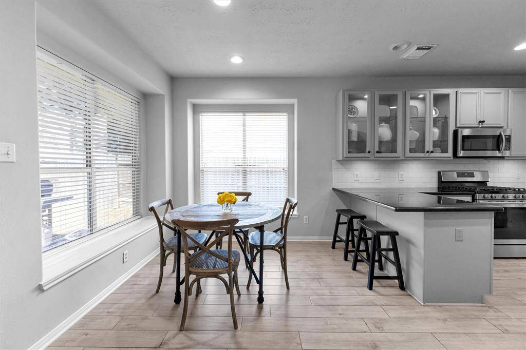 At the opposite end of the Kitchen is the cozy Breakfast Room