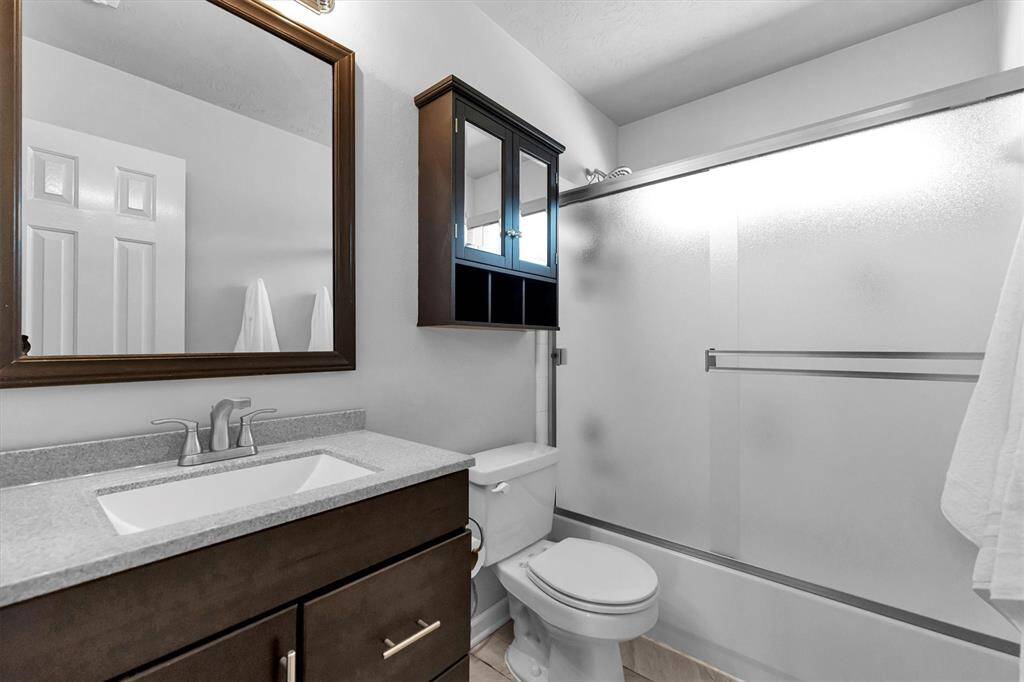 Full bath located in between the two of the three bedrooms upstairs