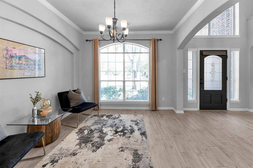 The inviting entryway transitions beautifully to the formal dining, office or sitting area.