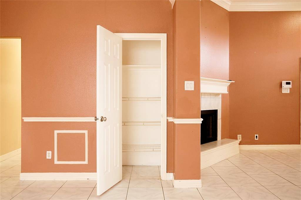 Coat Closet w/Fireplace in background