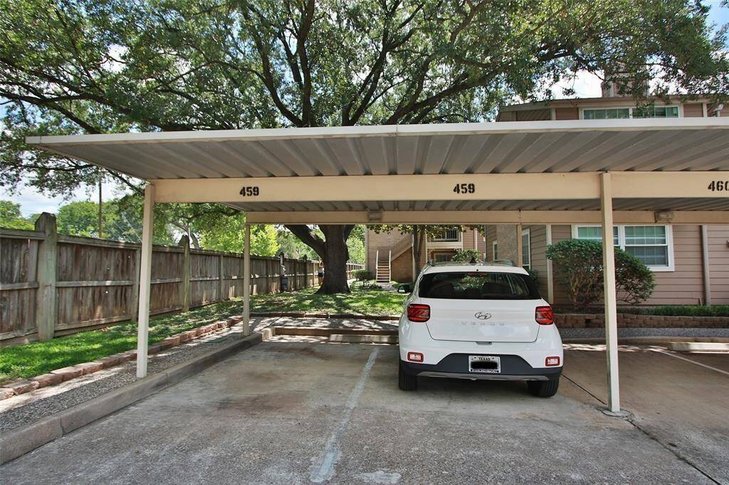 Two covered parking spot next to building