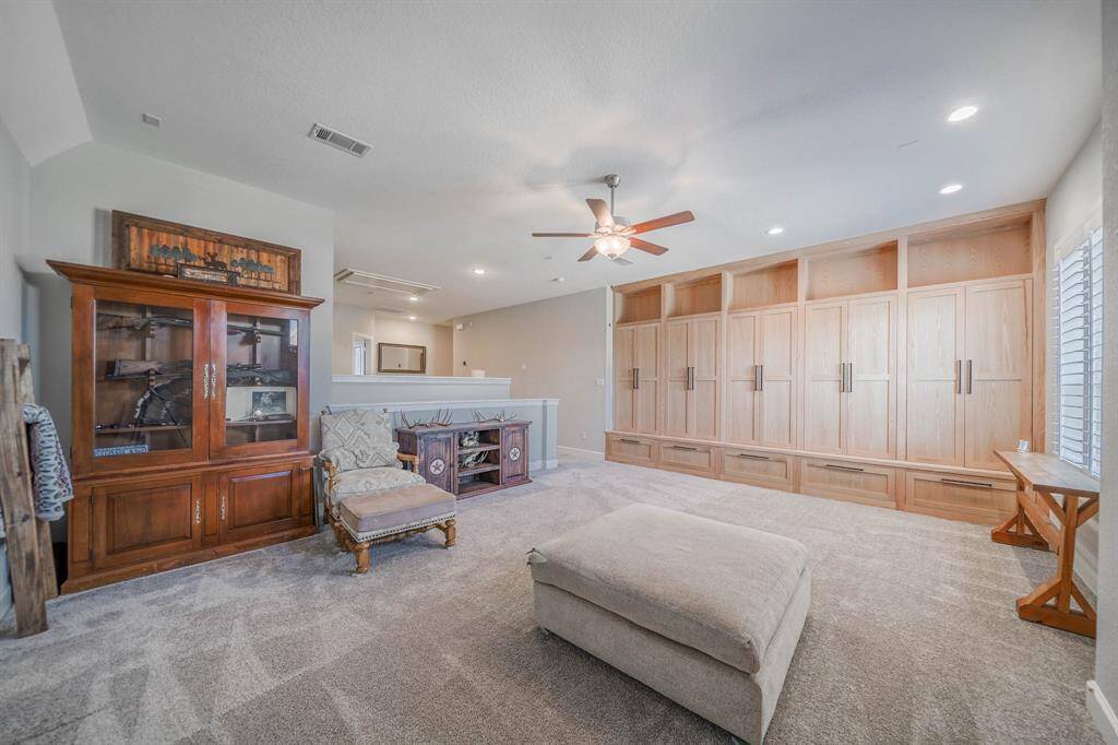Upstairs loft with spacious custom Red Oak built cabinetry