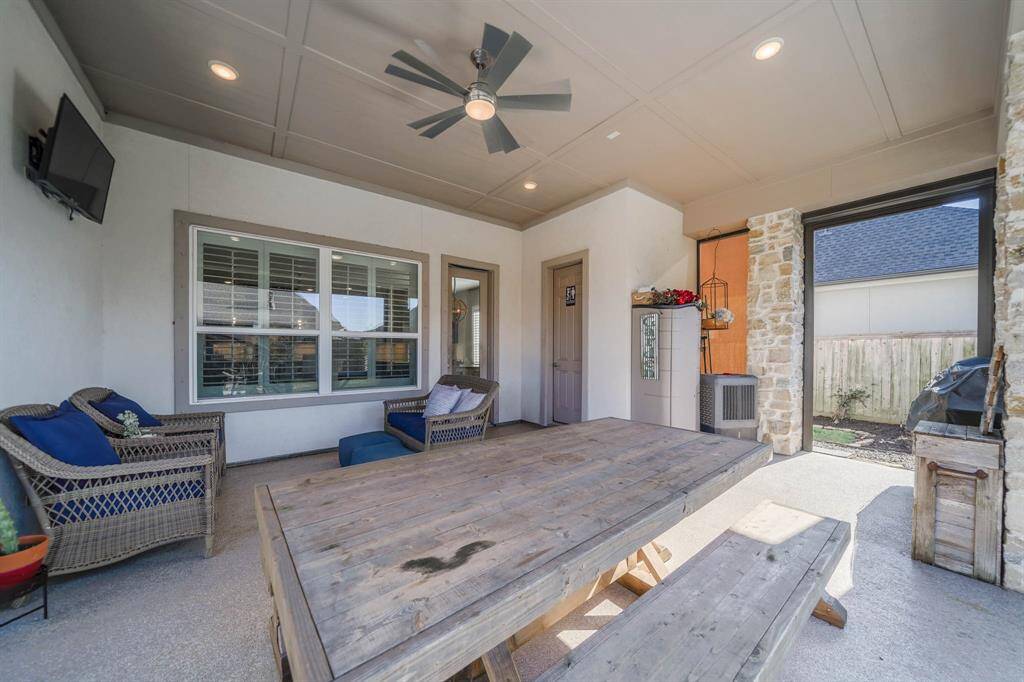 Outdoor patio area with water and gas connections for outdoor kitchen. TV staying.