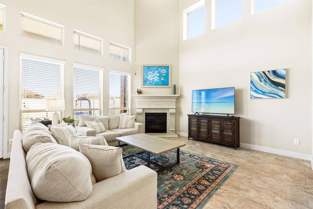 Architectural Awe – With stunning high ceilings, oversized windows, and an open-concept design, this living room isn’t just the heart of the home—it’s the show-off spot where everyone gathers to gawk and say, "Wow!"