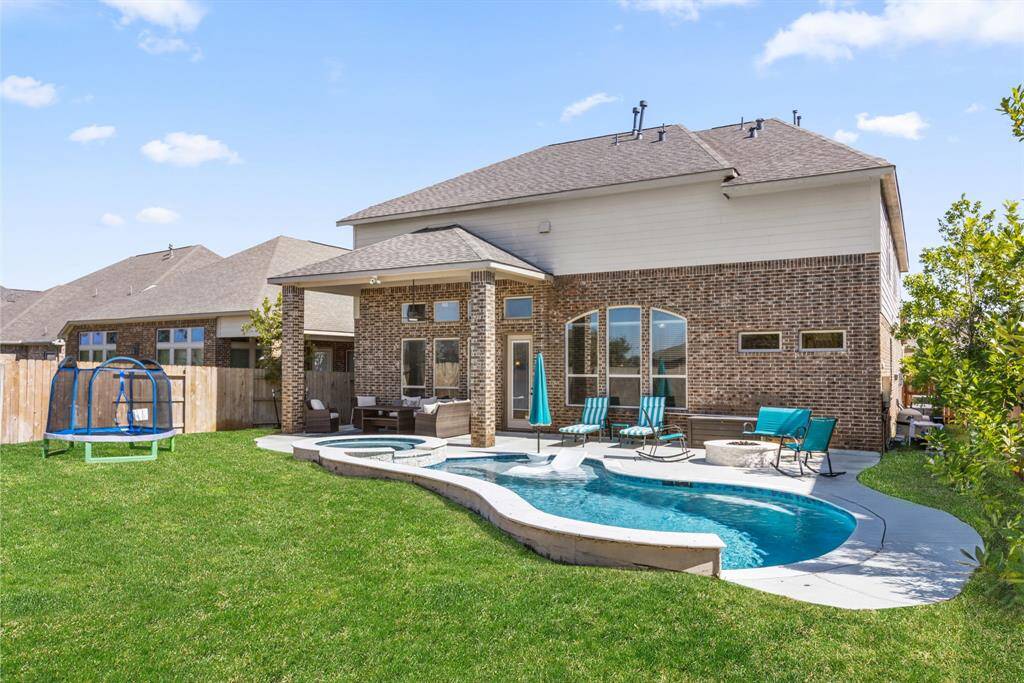 Backyard Paradise, Step into your private oasis, complete with a sparkling pool, relaxing hot tub, and tranquil water features for the ultimate outdoor retreat. You can also enjoy a warm fire by the water. No lugging a pesky propane tank, gas line is BUILT IN!