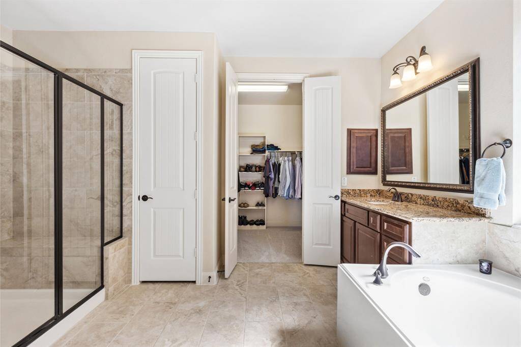 Spa Day, Every Day – Step into this luxury en-suite bath, where the walk-in shower is big enough for a dance party, the soaking tub feels like a hug, and the finishes are so fancy, you'll wonder if you're in a 5-star resort—minus the checkout time!