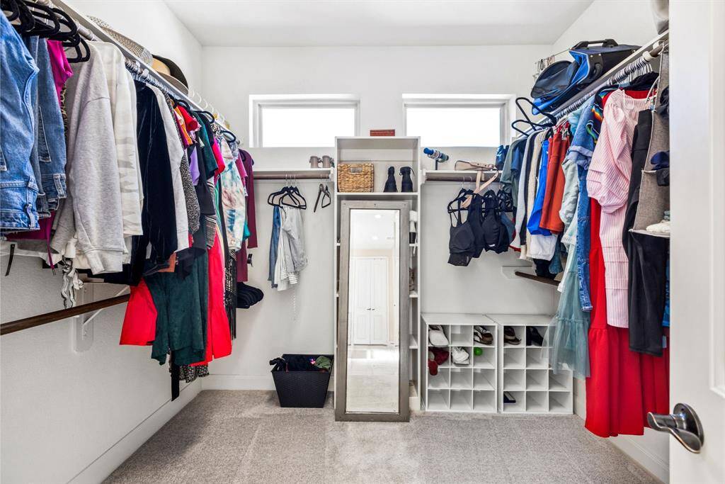 Her Closet, Her Rules – This walk-in closet is all hers—because who needs to share when you have enough space for shoes, bags, and possibly a small vacation home? Perfect for all her stuff (and maybe a little bit of yours... if you're lucky).
