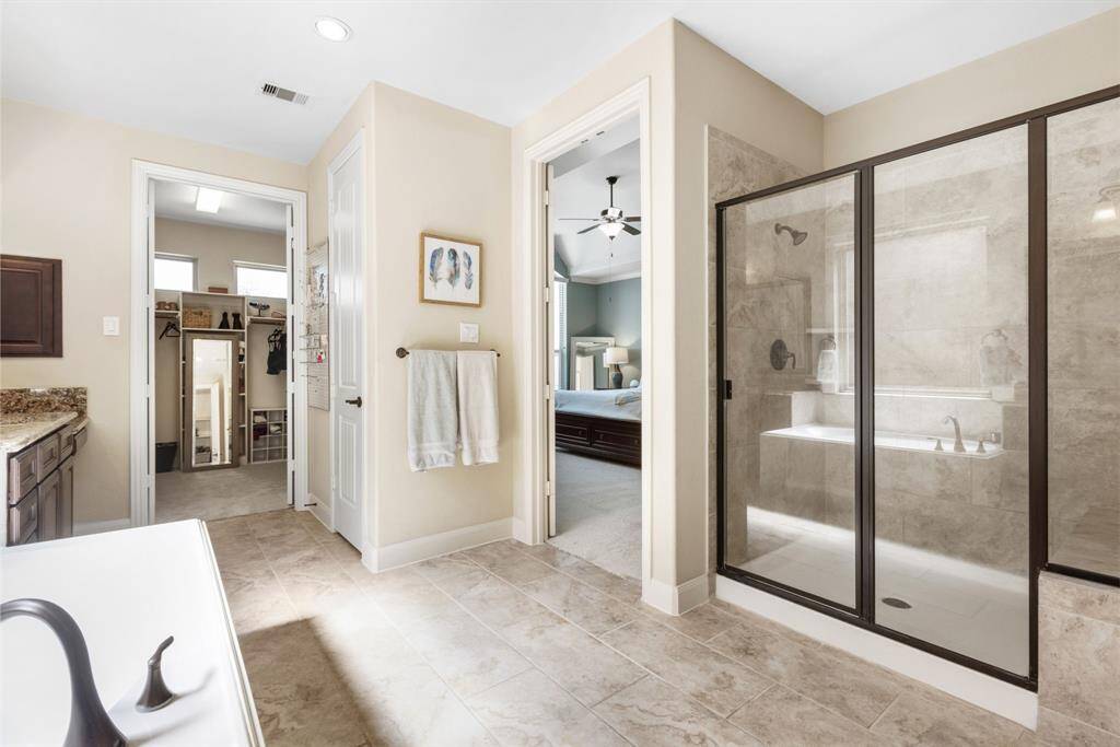 Shower Goals – Step into this oversized walk-in shower—so spacious, you might need a map to find the soap! With sleek tilework and premium fixtures, it's basically your own personal spa, minus the fluffy robes.