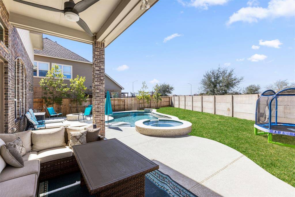 Patio Perfection – This expansive covered patio is perfect for dining, lounging, or pretending you're on a tropical vacation—no sunscreen required! Enjoy the outdoors year-round, or just avoid mowing the lawn.