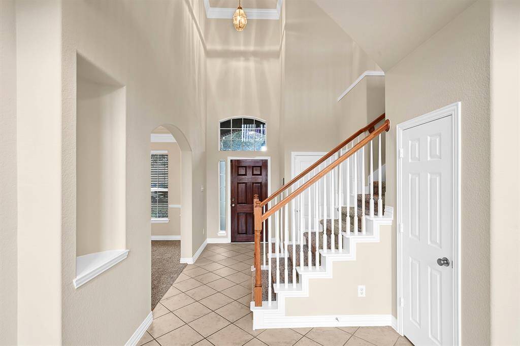 Formal entry showcasing brand new carpet and fresh interior paint throughout.