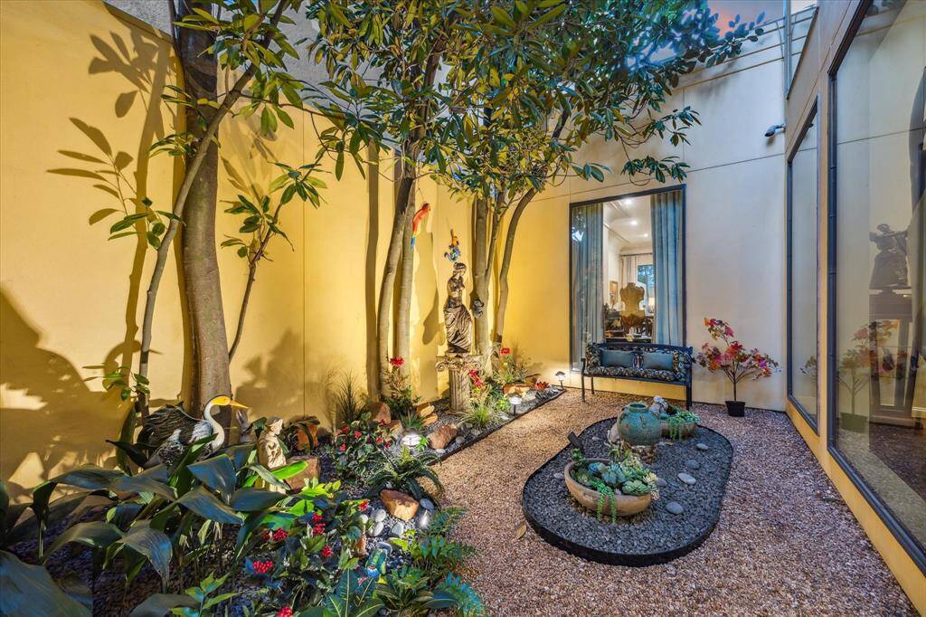 ATRIUM-This peaceful Zen like garden is a showstopper. Notice the beautiful greenery and landscape lighting.
