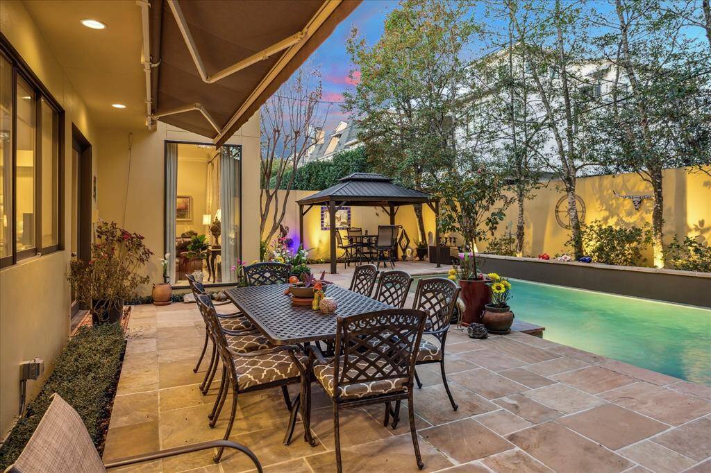 An extra large retractable awning was recently installed and allows for shade during the sunny days. This large area is like having an additional outdoor living space in your own backyard.