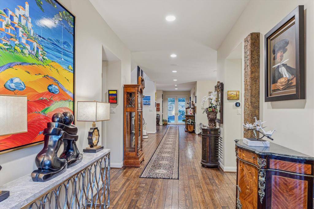 Notice the WOW factor as your guests enter the home with the gallery entry with views straight to the backyard oasis. This home is made for the art enthusiast with uninterrupted wall space for displaying your favorite art pieces.
