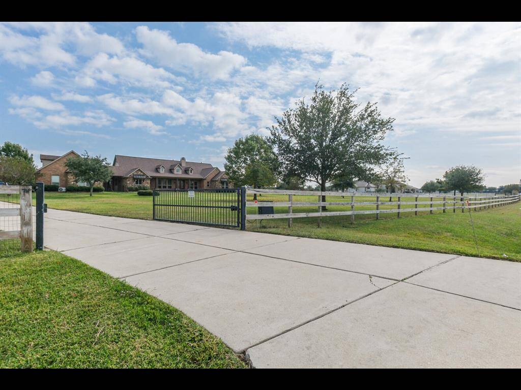 Fully fenced with automatic gate to access the home.