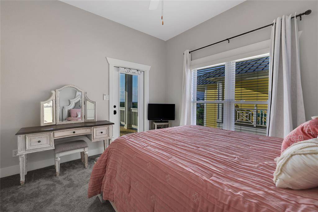 Secondary bedroom upstairs.  Has its own covered patio deck area as well facing the ocean side.