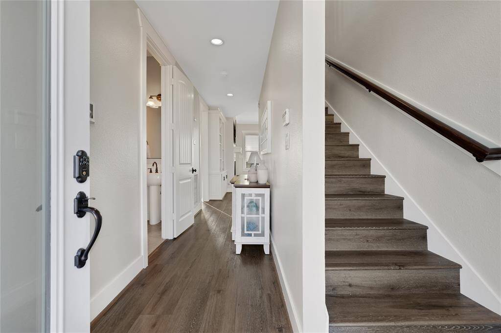 Entry way opens up the the stair way or the hallway to the home.