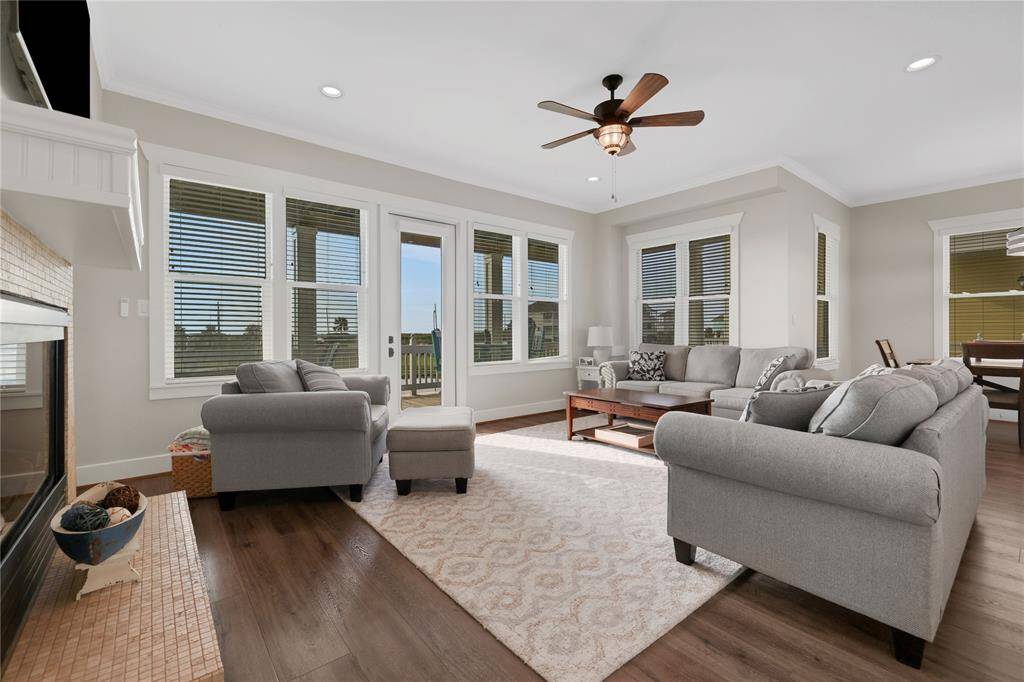 Spacious Living room open to the kitchen, dining area with lots of natural light from the double doors and windows facing the ocean side.