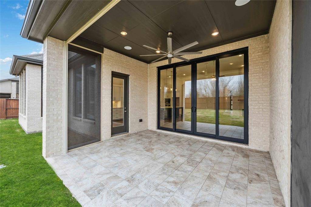 Covered and screened in patio.The screen accessing the backyard is remote controlled